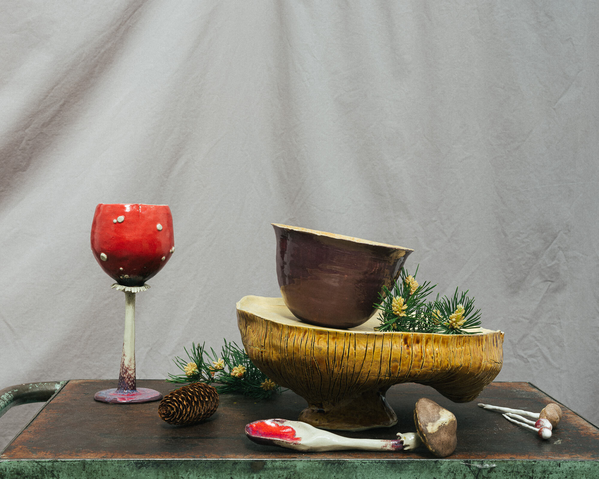 forest inspired table set, with a bowl, glass and a spoon